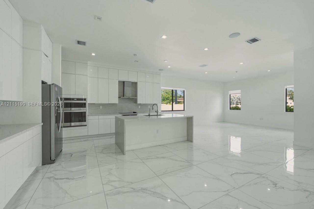 Kitchen island and surrounding cabinetry.