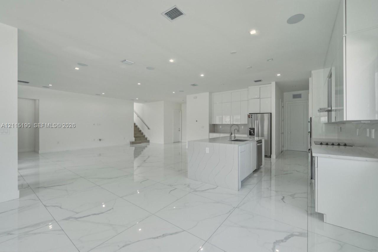 Island kitchen overlooking the living area.