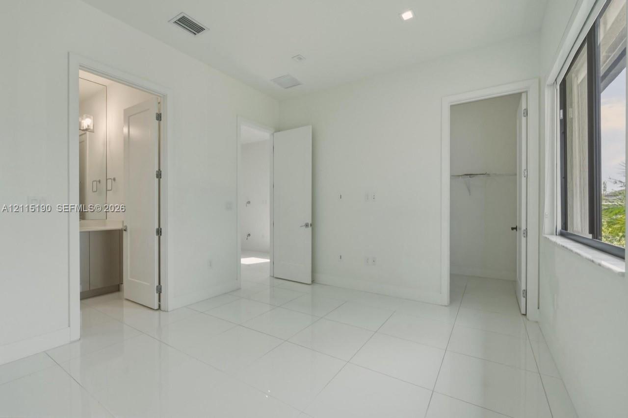 Bedroom and adjoining bathroom.