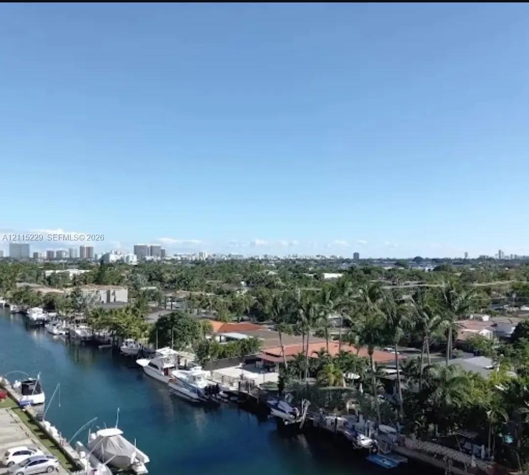 Waterfront canal setting with private boat dockage and mature tropical landscaping