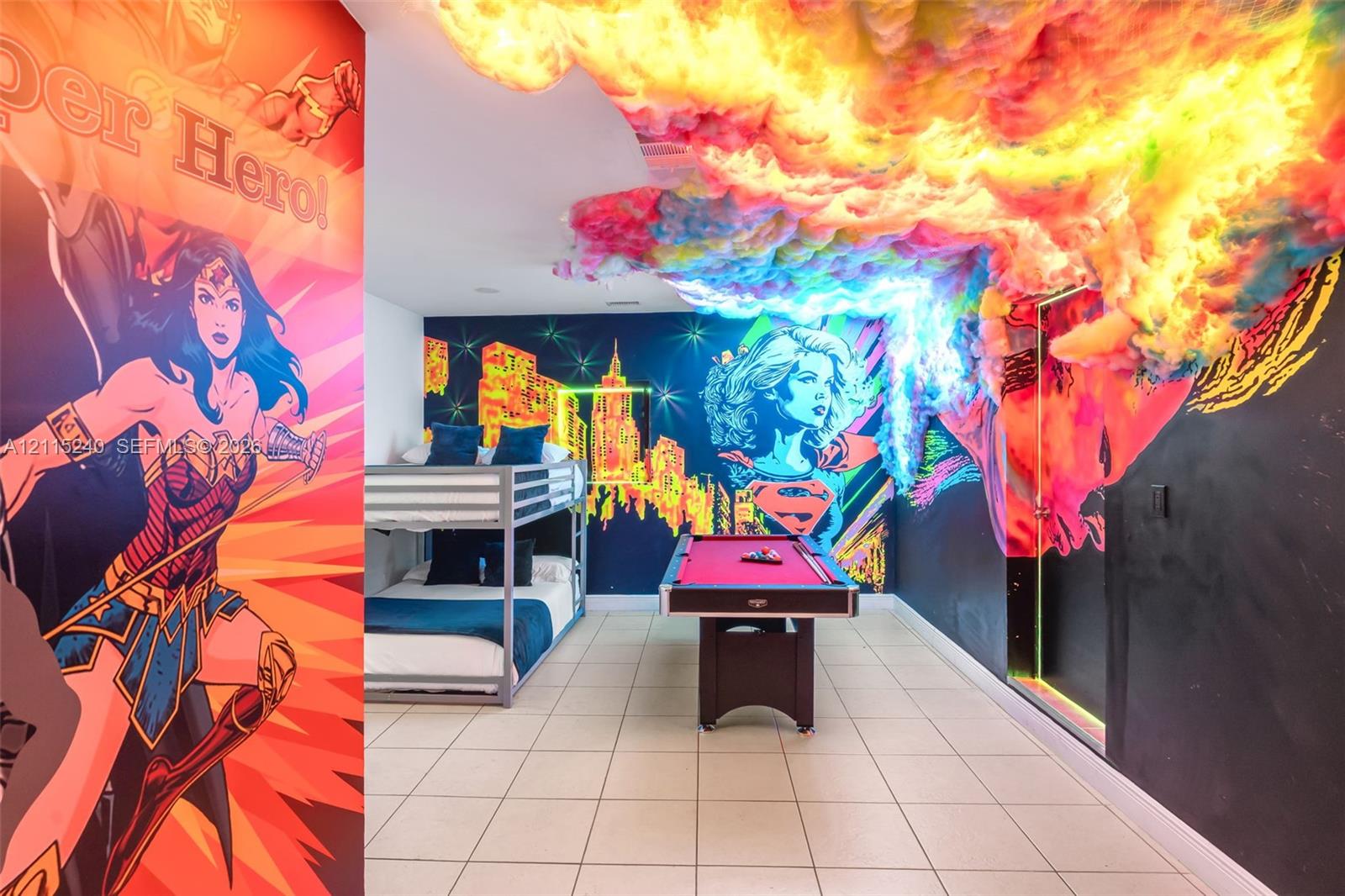 Interior space featuring tile flooring, recessed ceiling lighting, and custom wall murals