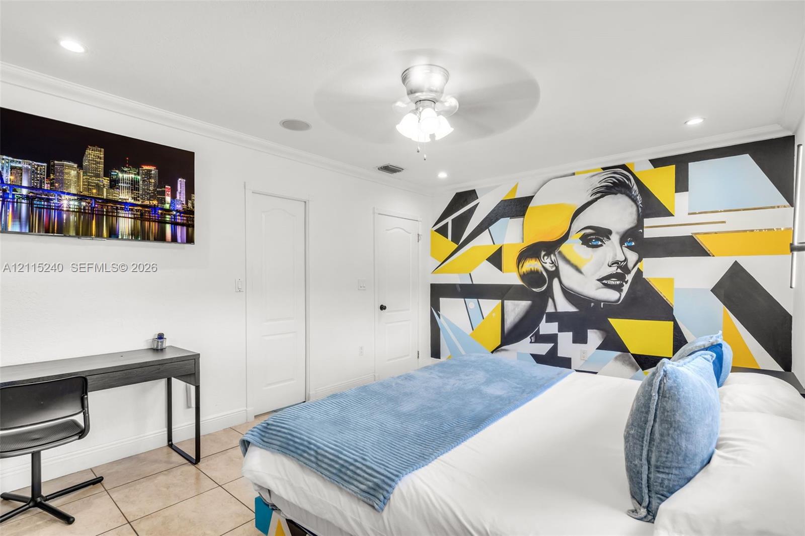 Neutral-toned ceramic tile flooring, recessed ceiling lighting, and a central ceiling fan with integrated lighting