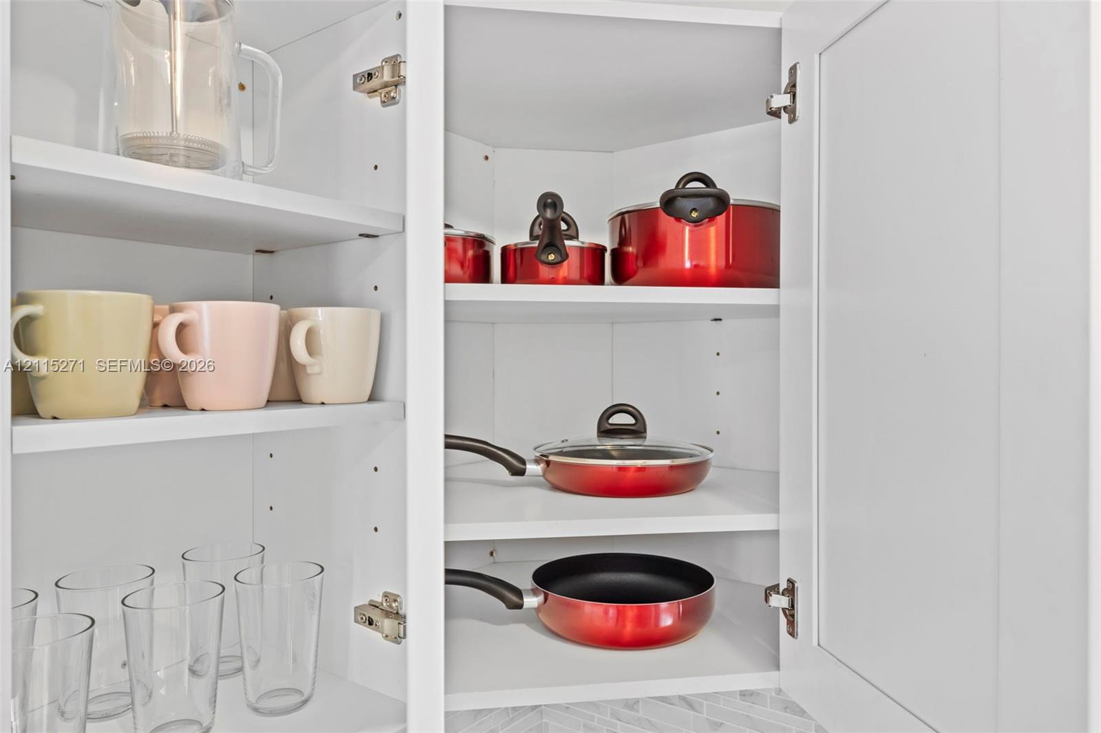 White Shaker-style cabinetry featuring adjustable interior shelving and soft-close hinges
