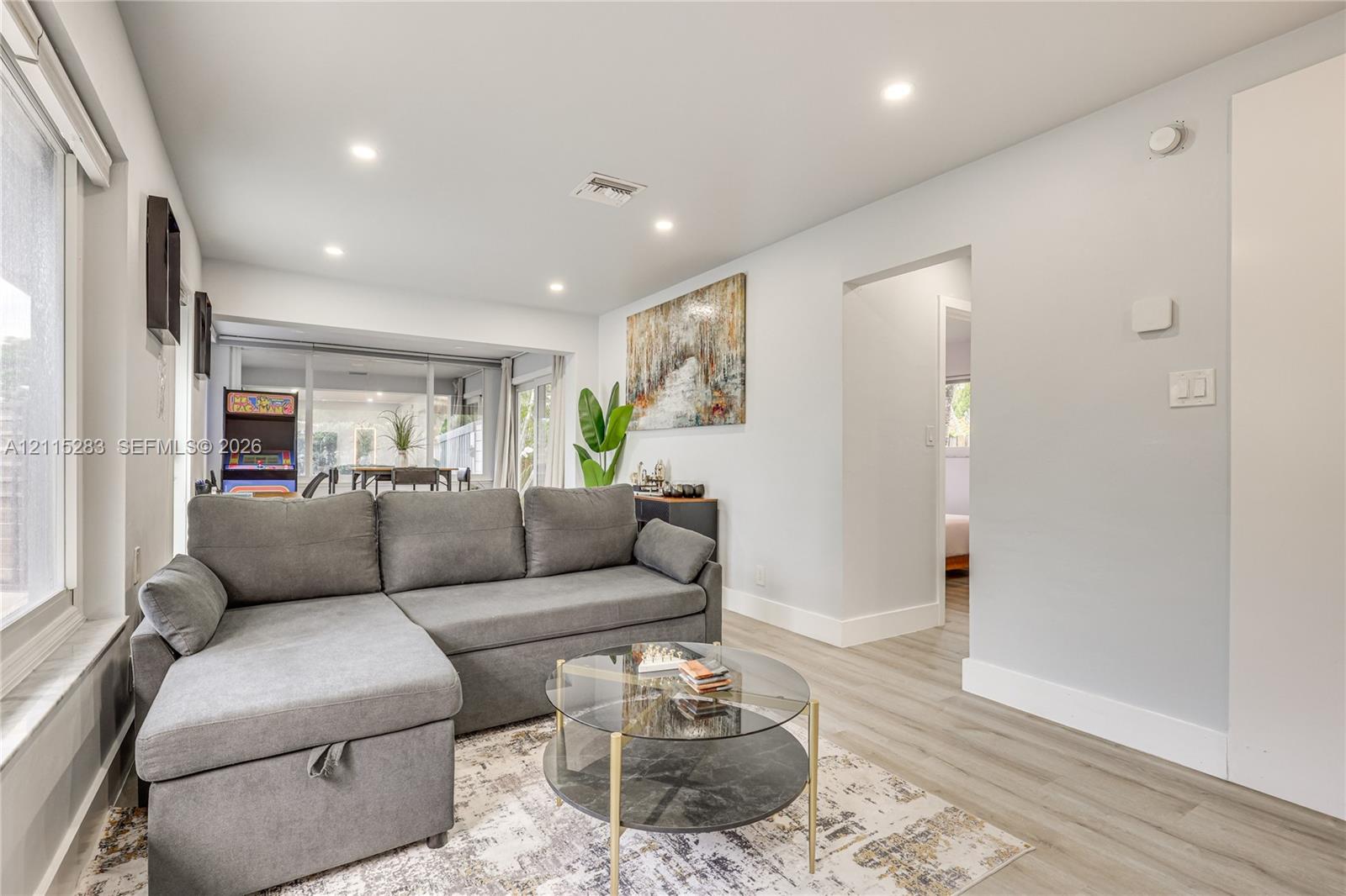 Recessed lighting, wood-finish flooring, and expansive windows Recessed lighting, wood-finish flooring, and expansive windows