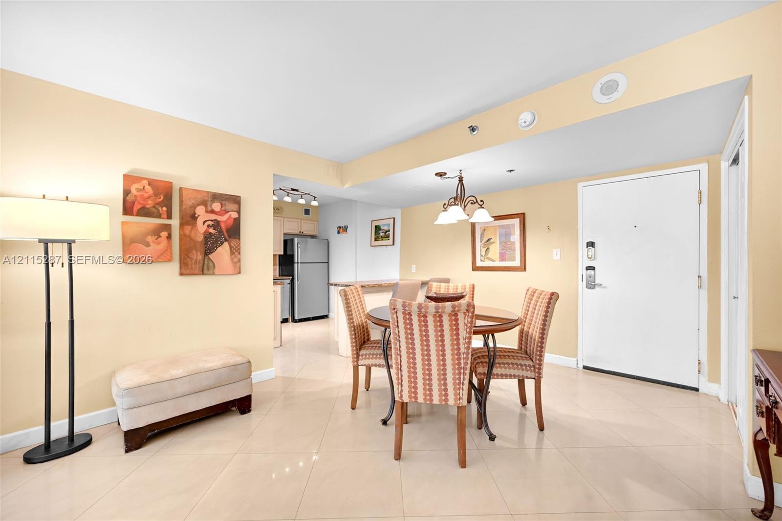 Open floor plan featuring tile flooring, recessed lighting, and a multi-light chandelier