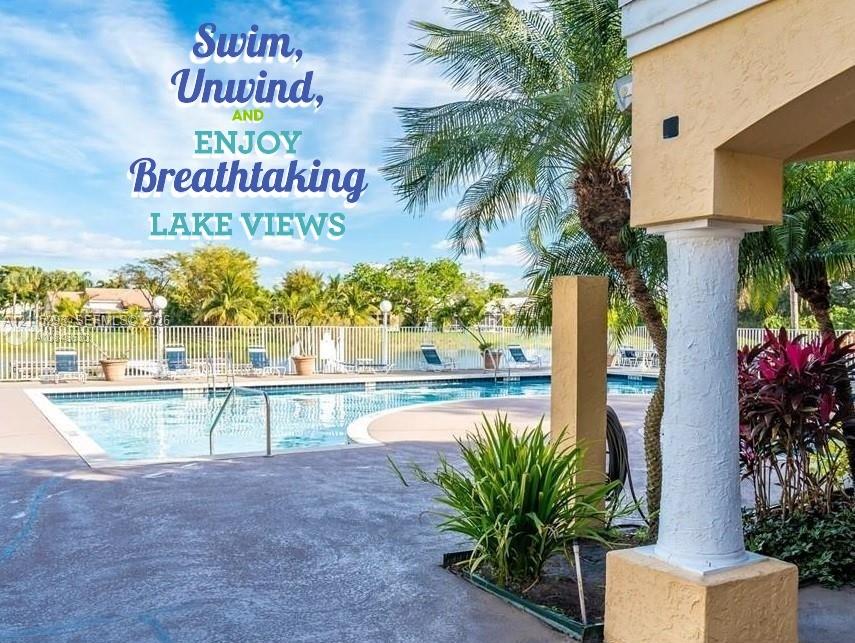 Swimming pool with a concrete deck, white metal fencing, and decorative pillar architectural elements