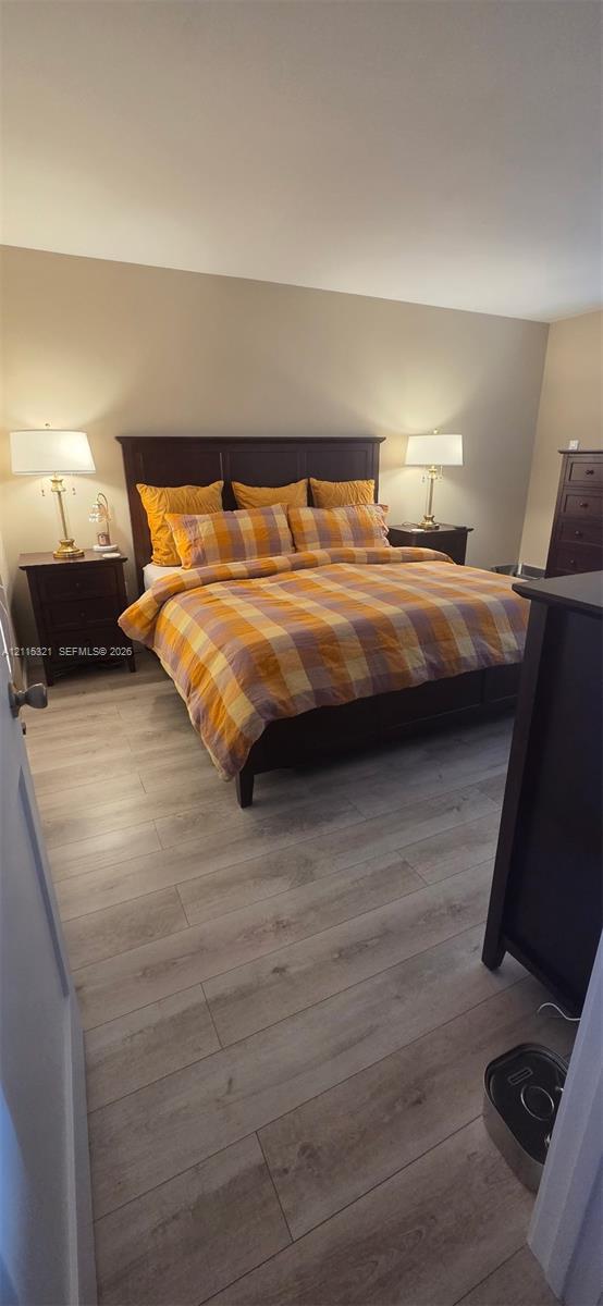 Neutral wall finishes and wide-plank wood-finish flooring