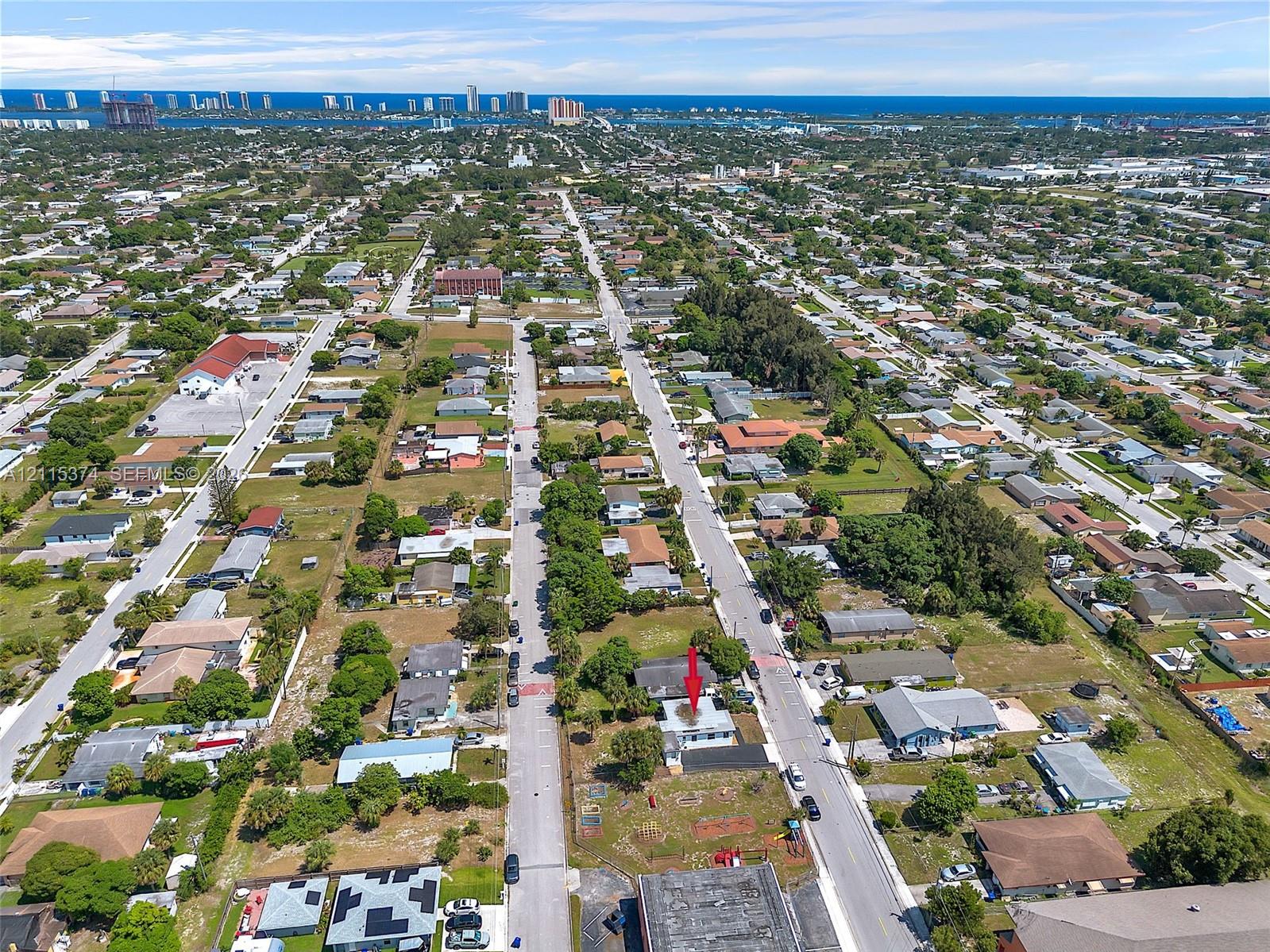 Aerial perspective featuring a corner lot location, proximity to coastal waters, and established residential neighborhood infrastructure
