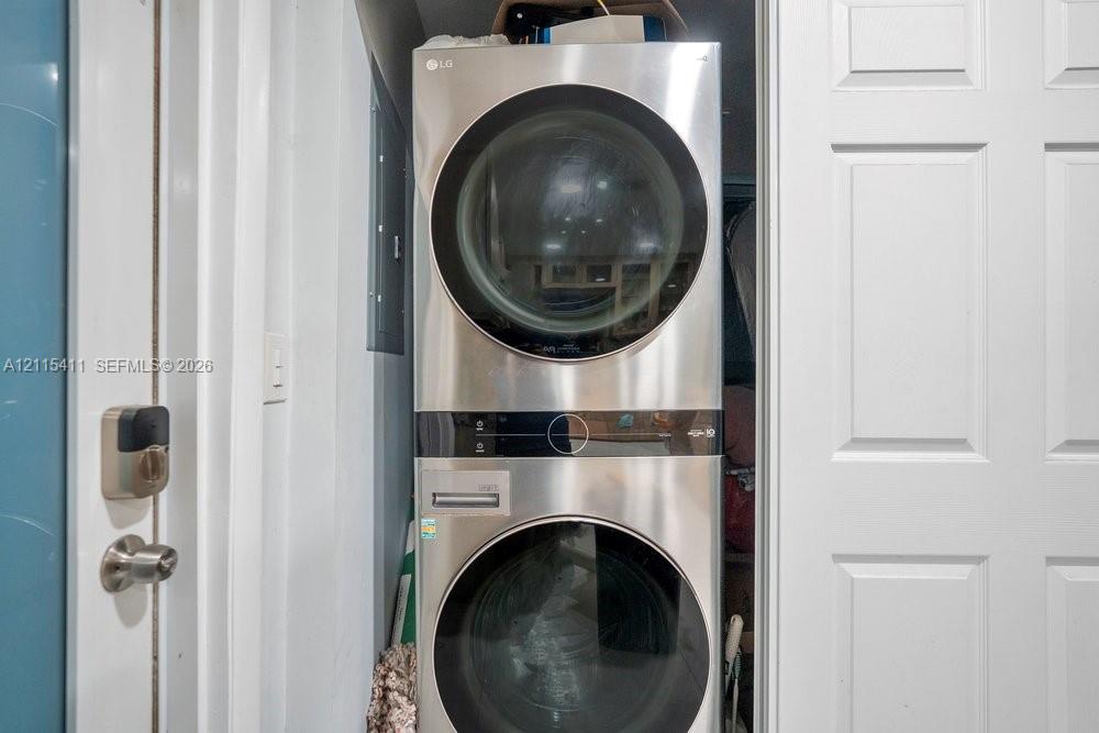 Stacked stainless steel LG laundry unit featuring digital controls and circular glass doors