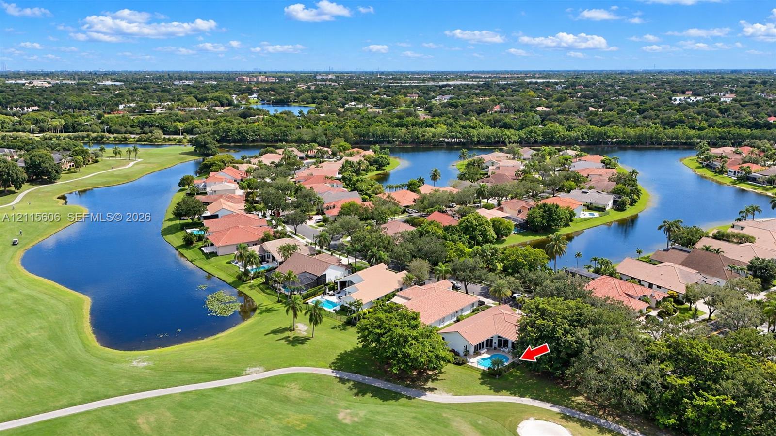Aerial perspective featuring a waterfront property with an in-ground swimming pool and direct proximity to a golf course Aerial perspective featuring a waterfront property with an in-ground swimming pool and direct proximity to a golf course