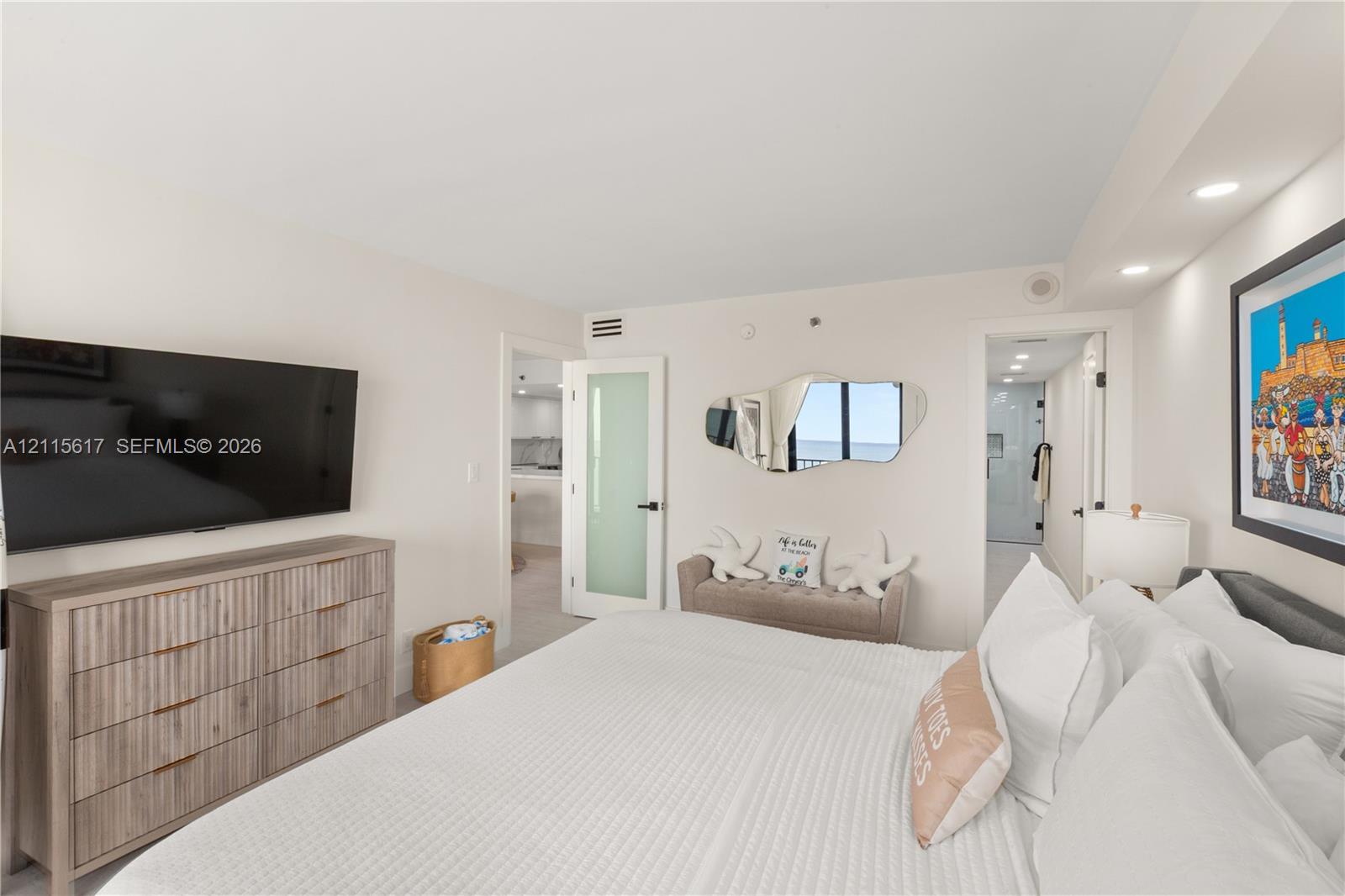 Interior space featuring recessed lighting, a frosted glass-panel door, and smooth-finish walls