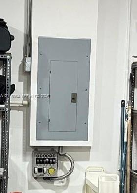 Wall-mounted electrical service panel with an integrated generator transfer switch