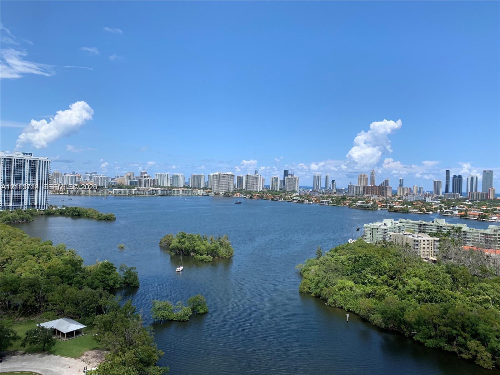 Panoramic coastal waterway backdrop with expansive cityscape horizon