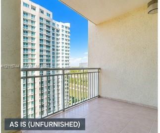 Private balcony featuring a tiled floor, textured wall finish, and metal railing