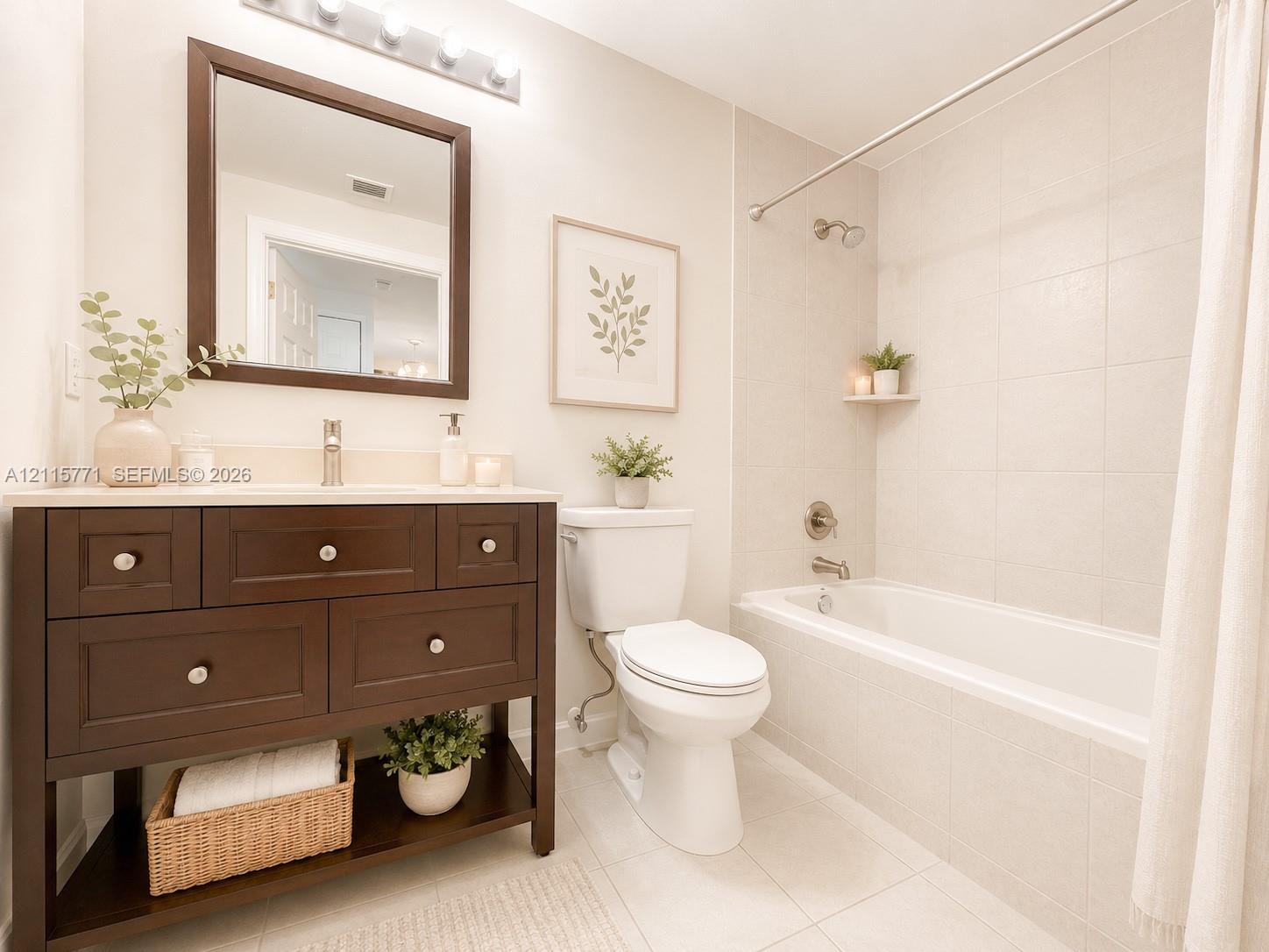 Dark wood-finish vanity with a rectangular sink, brushed nickel hardware, square wall-mounted mirror, and tiled shower surround with a built-in shelf