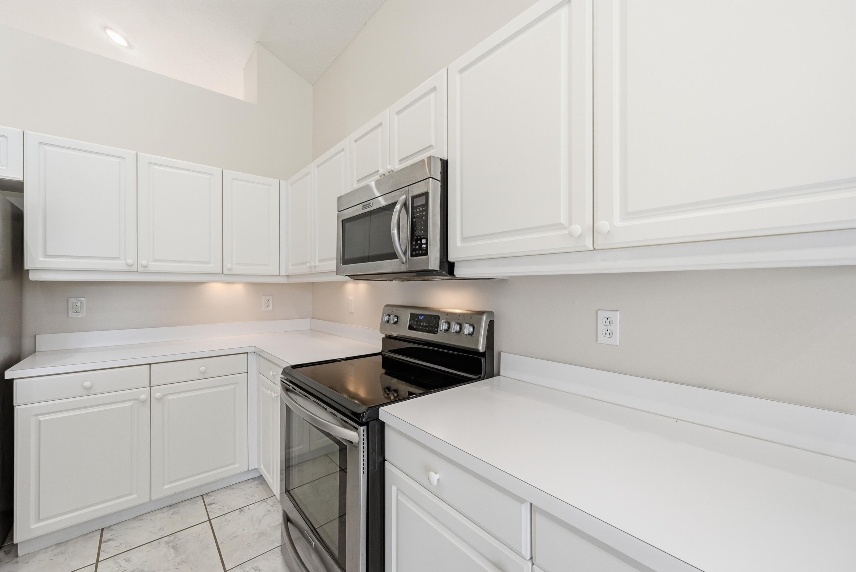 KITCHEN WITH NEWER STAINLESS STEEL APPLIANCES