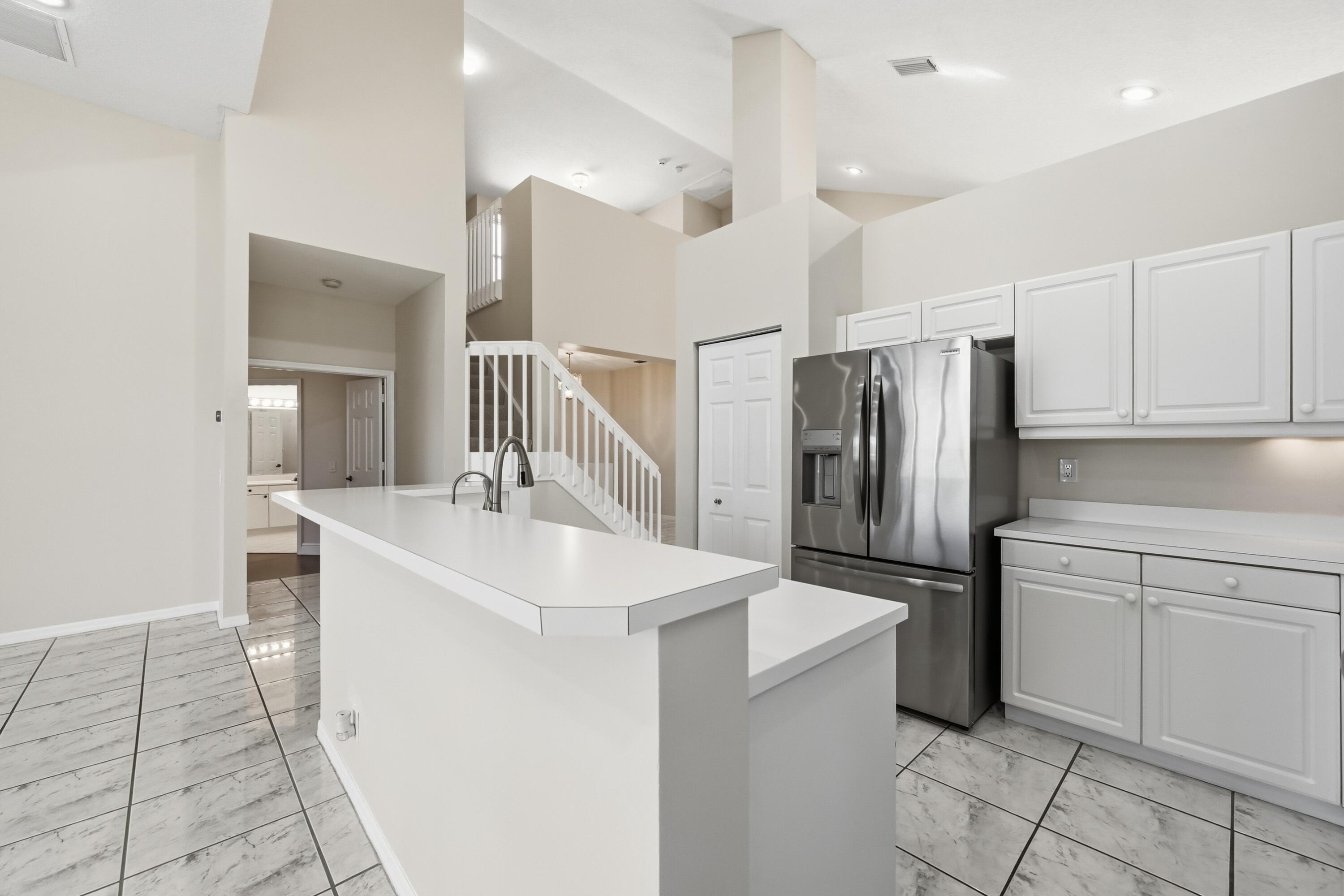 KITCHEN WITH NEWER STAINLESS STEEL APPLIANCES