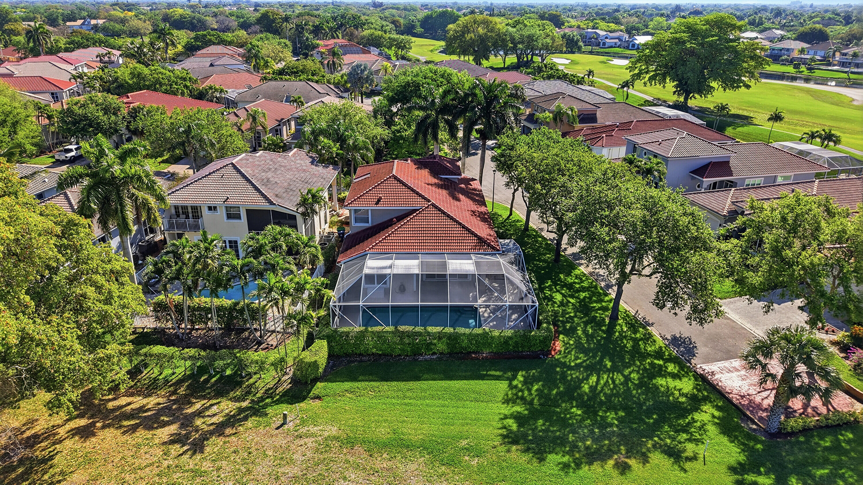REAR VIEW OF THE HOME WITH GOLF & SUNSET VIEWS
