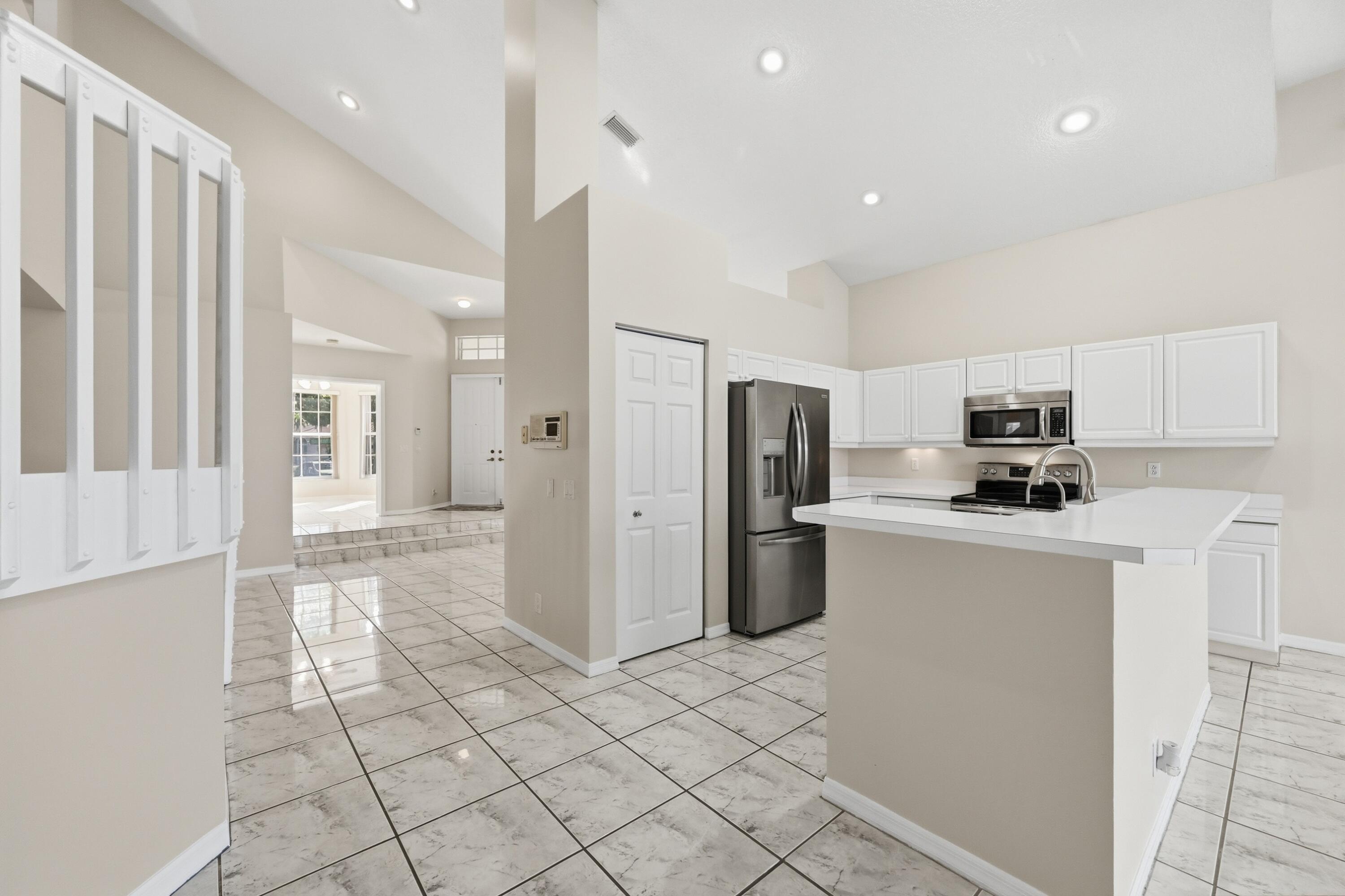 KITCHEN WITH NEWER STAINLESS STEEL APPLIANCES