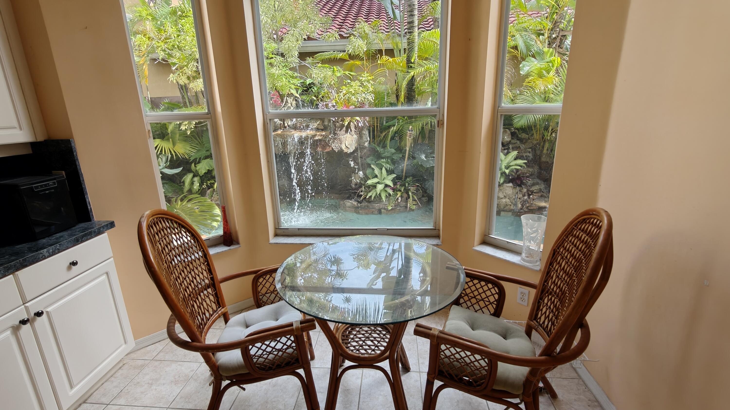 Breakfast area attached to kitchen- View of pool