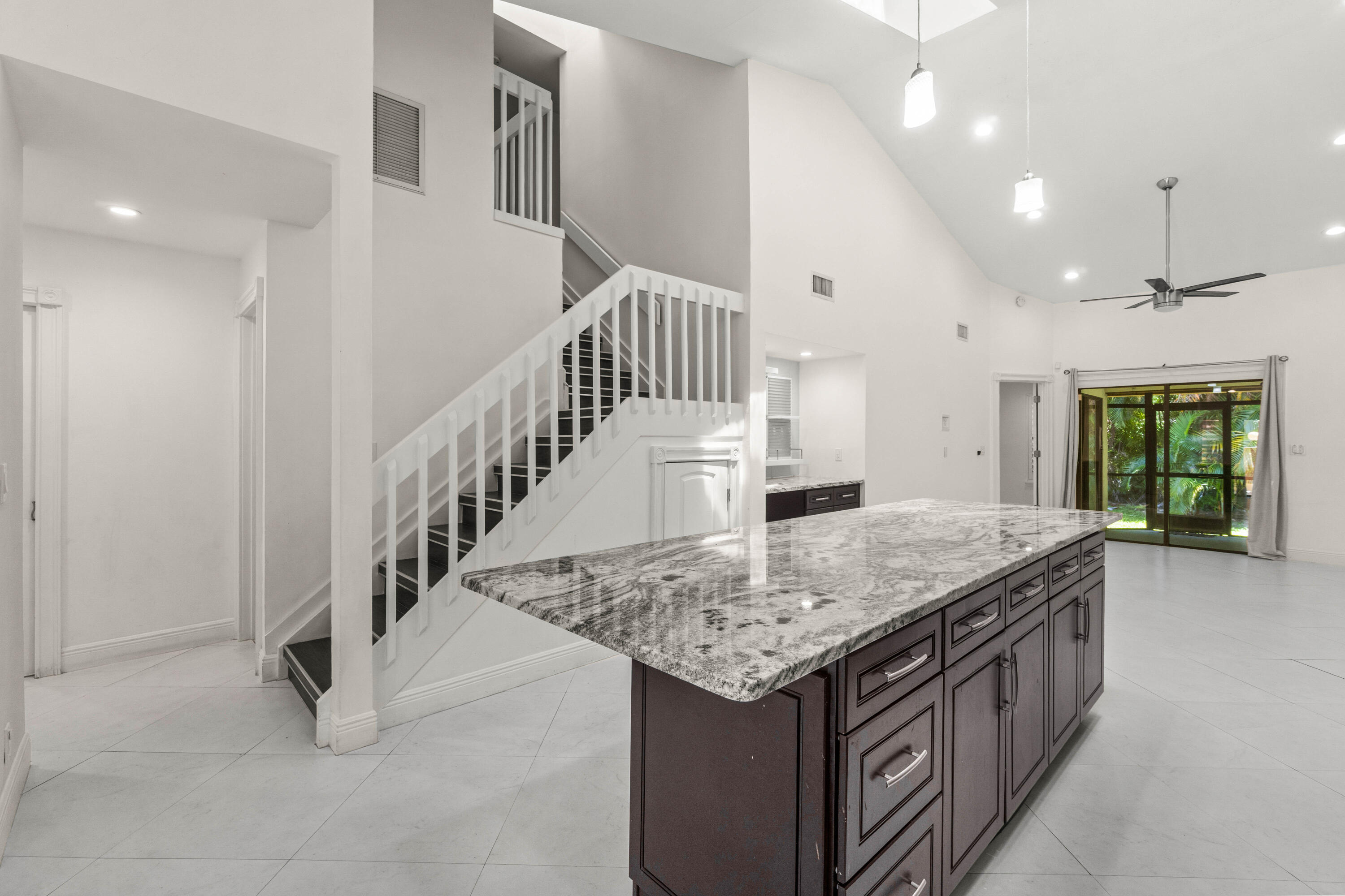 Light and bright Living Area -Skylights in Living Area - Elegant Staircase