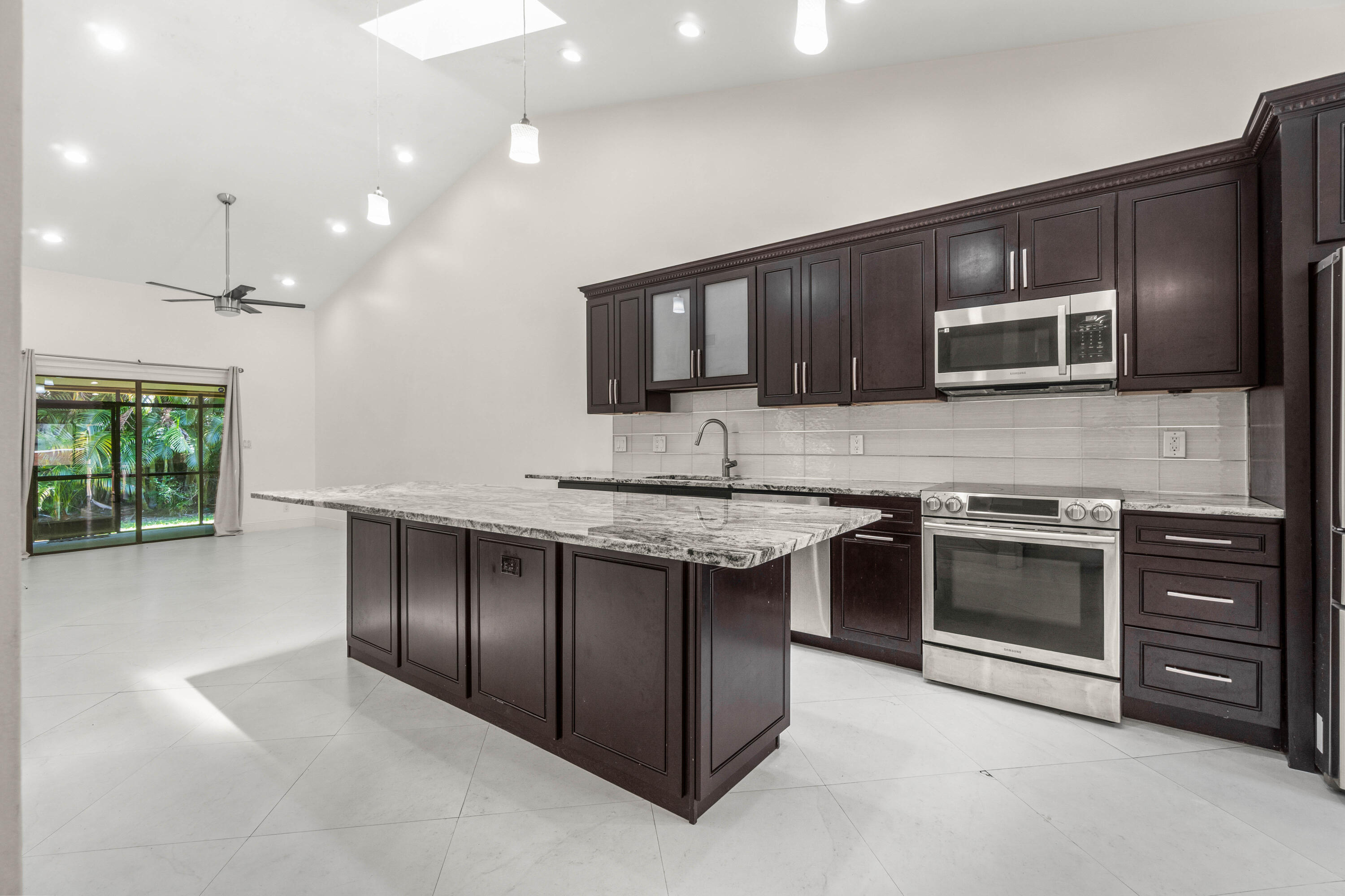 Gorgeous Open Floor plan with Vaulted Ceilings and Stunning Updated Kitchen ~ Light Filled Home with lots of natural sunlight from windows and skylights