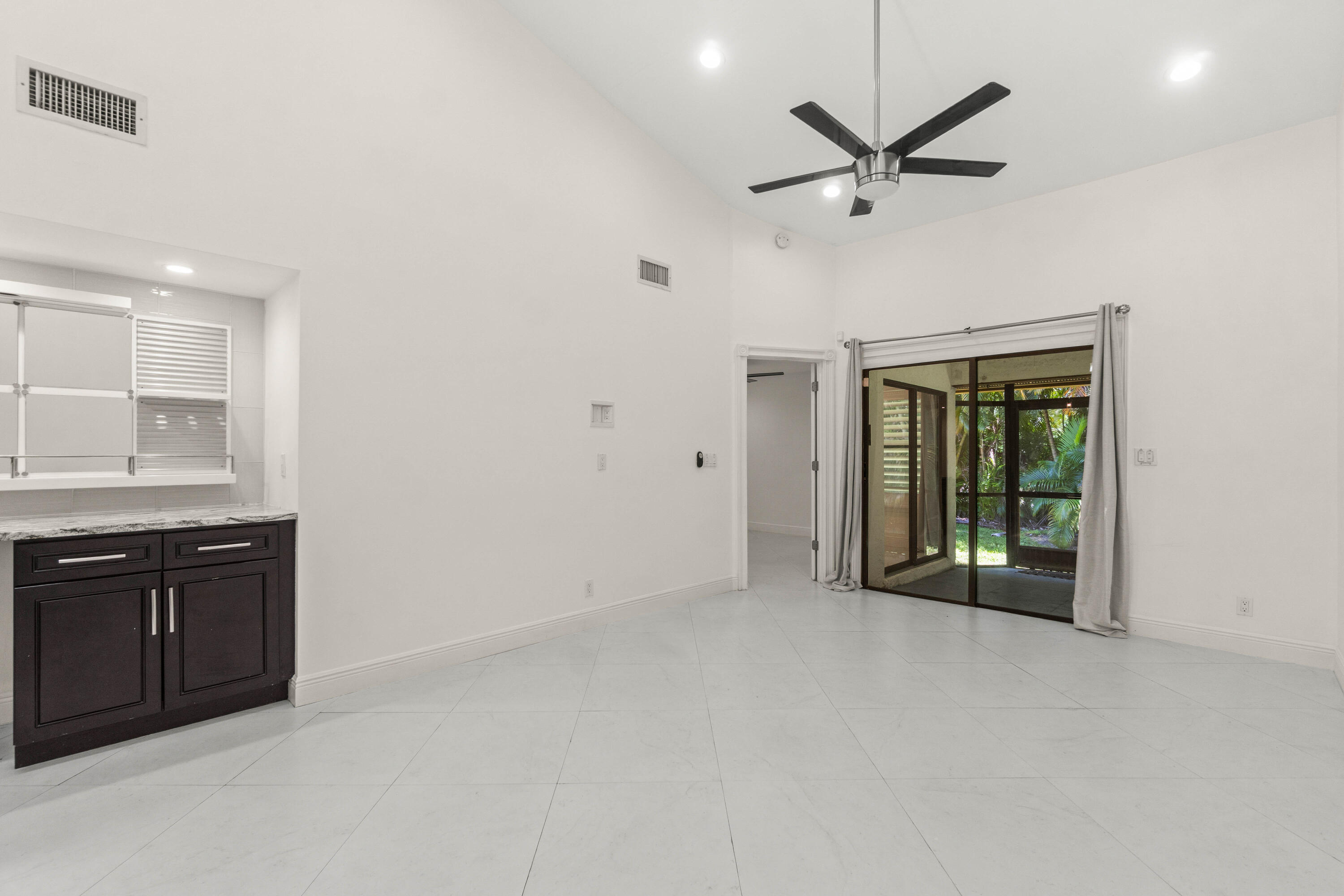 Spacious Living Area with Soaring Vaulted Ceilings and Plenty of Windows and Skylights