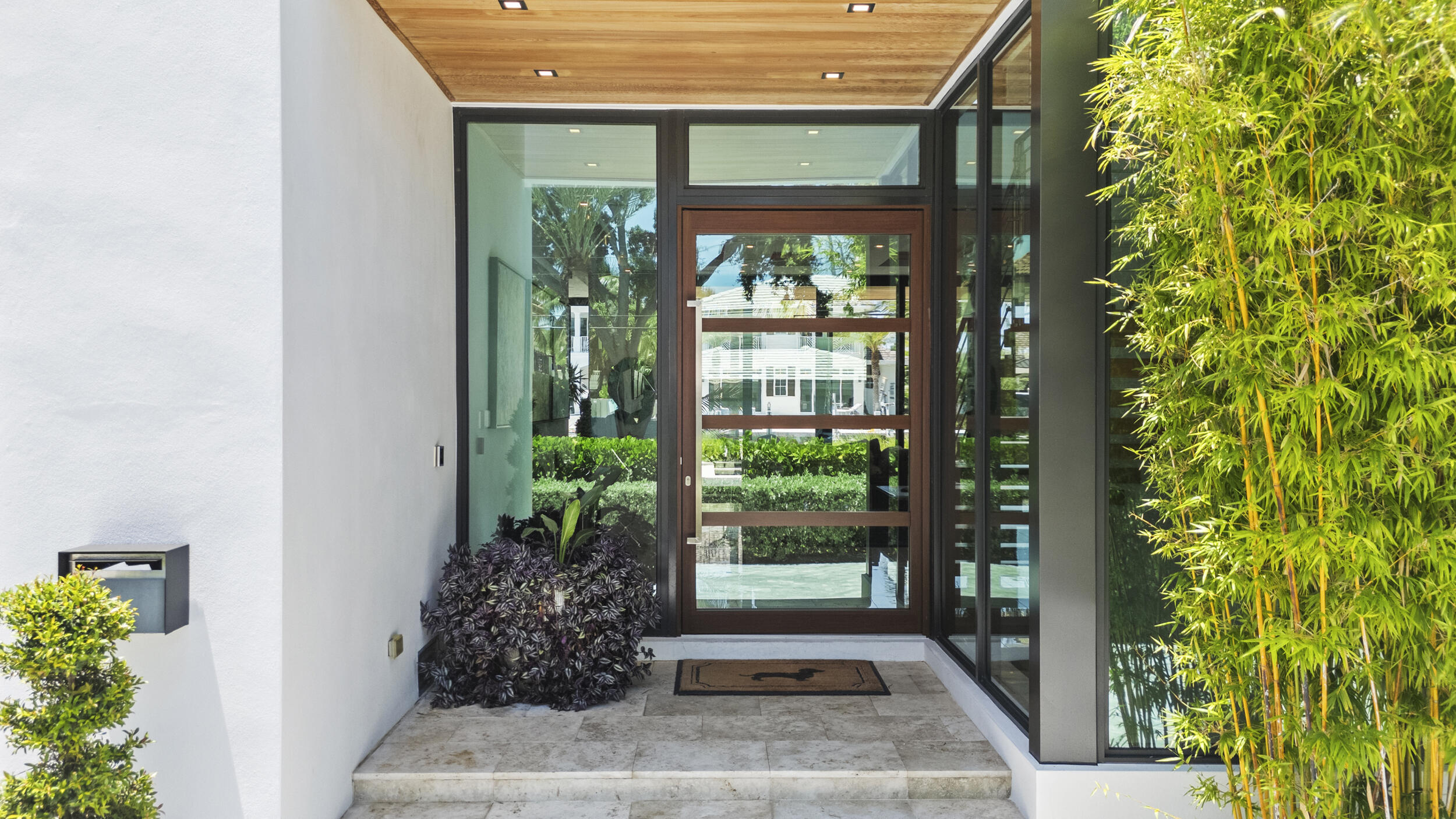 Oversized Pivot Entry Door.