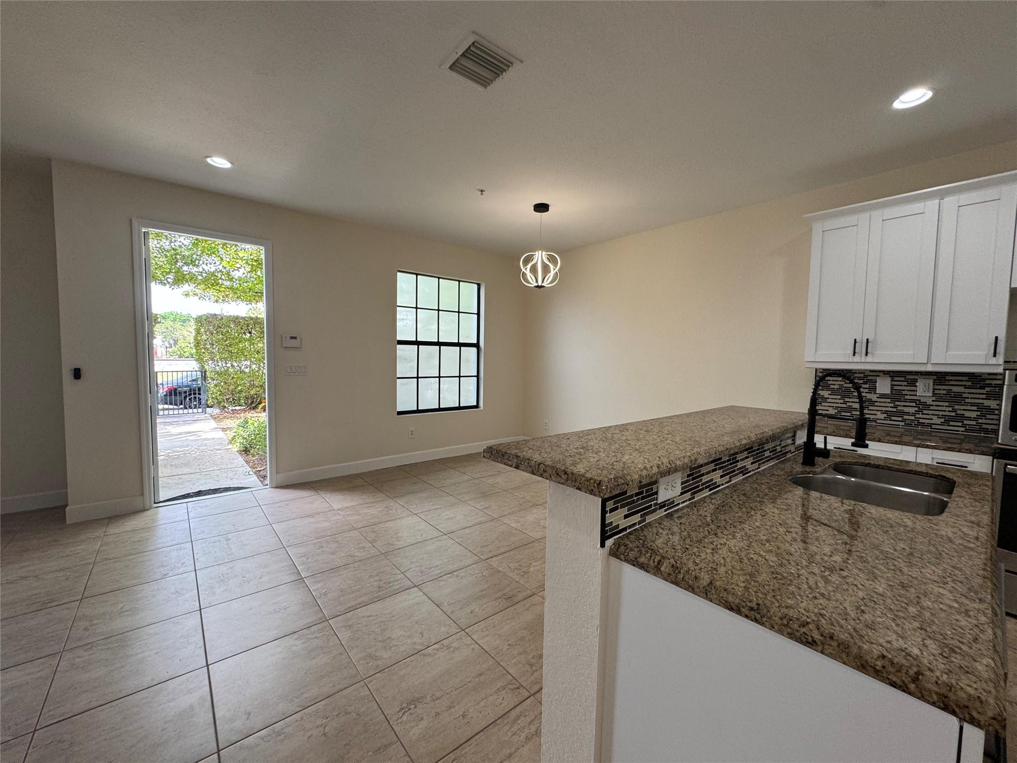 Dining Area, Entrance from the back yard.
