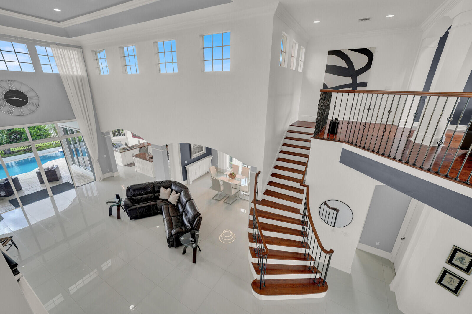 Grand two-story living area featuring high ceilings and expansive tile flooring