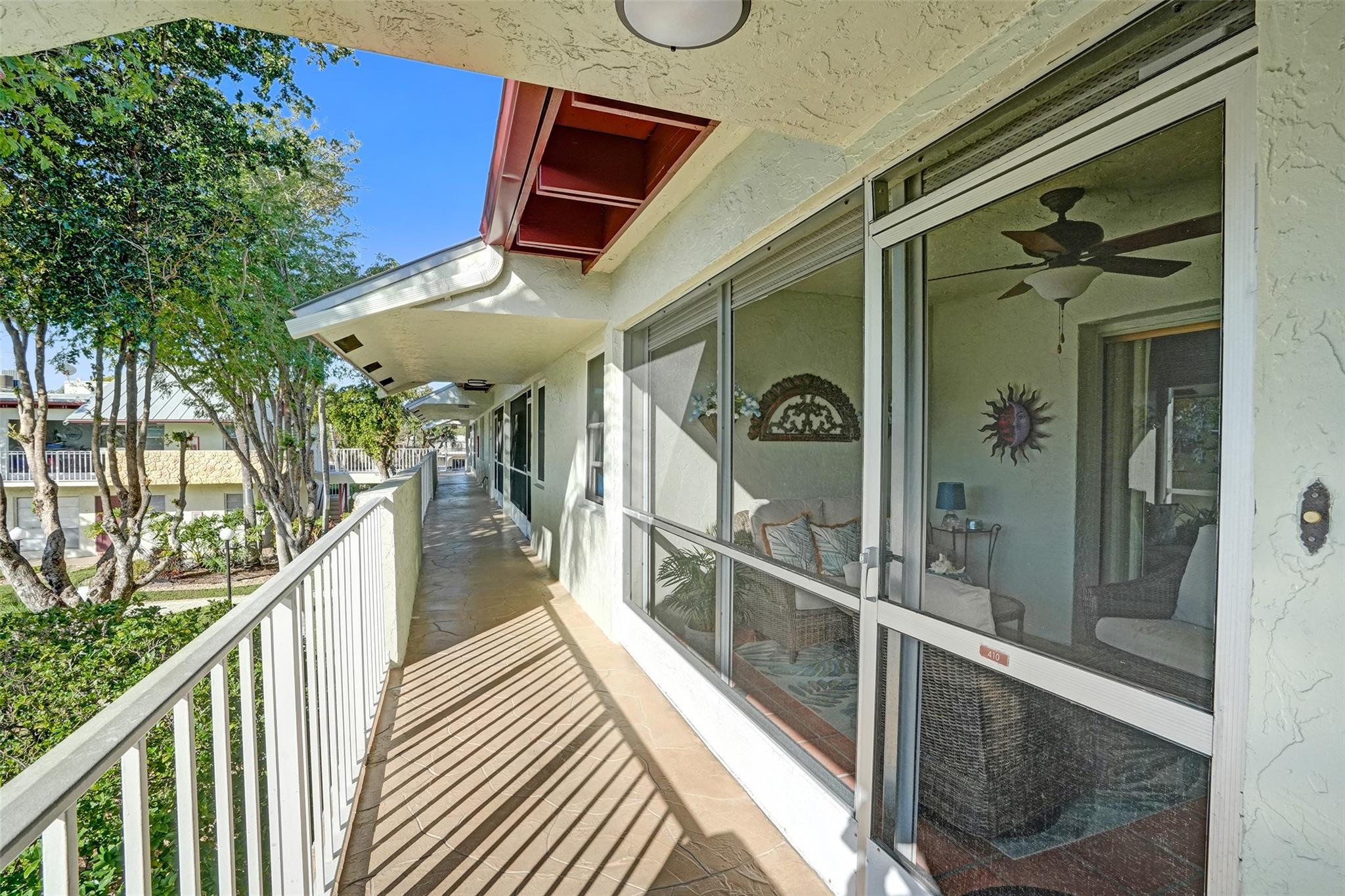 Charming covered catwalk guiding you to the screened -in lanai entrance