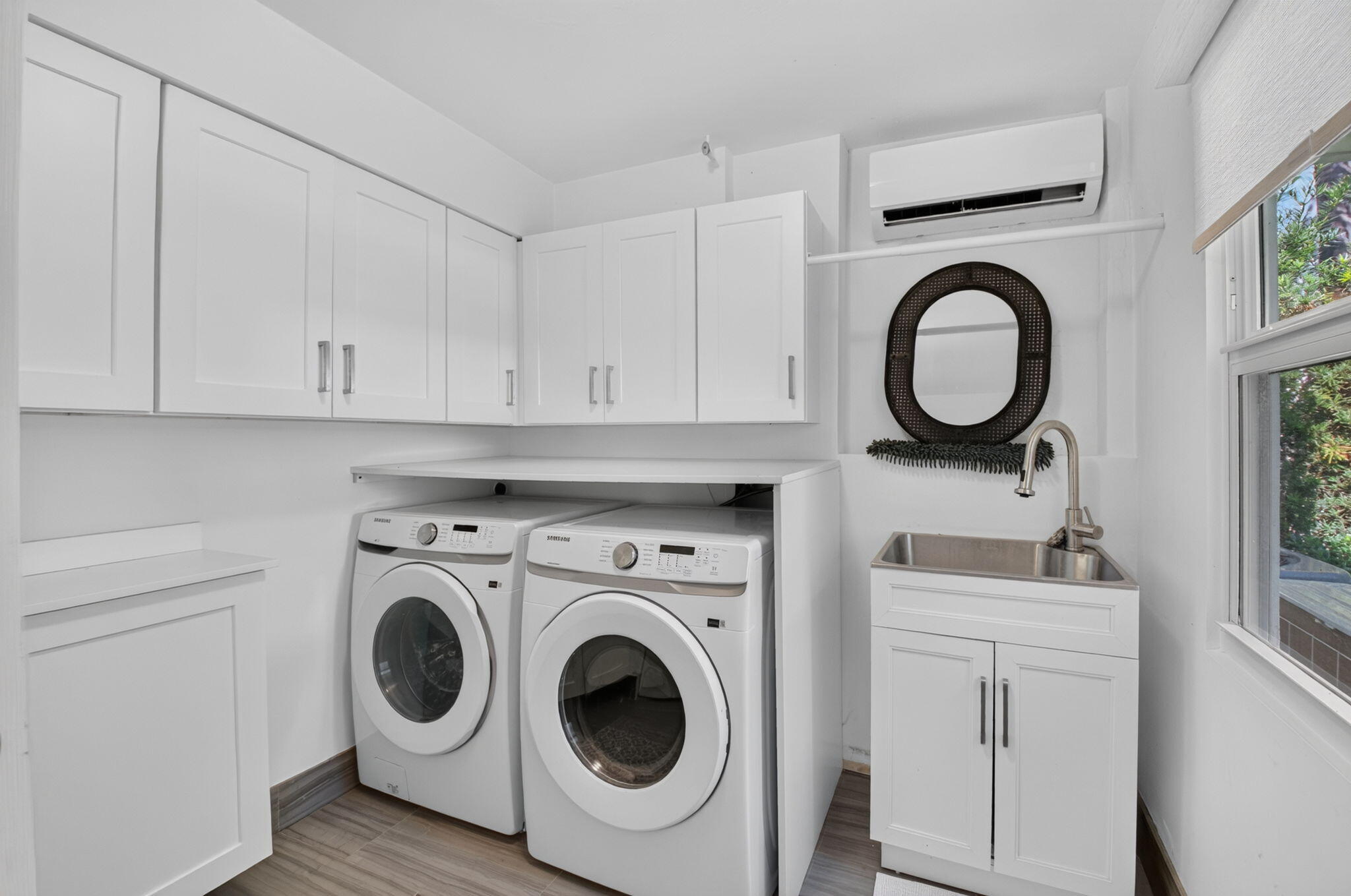 LAUNDRY ROOM HAS EXTERIOR DOOR TO BACK PATIO AREA