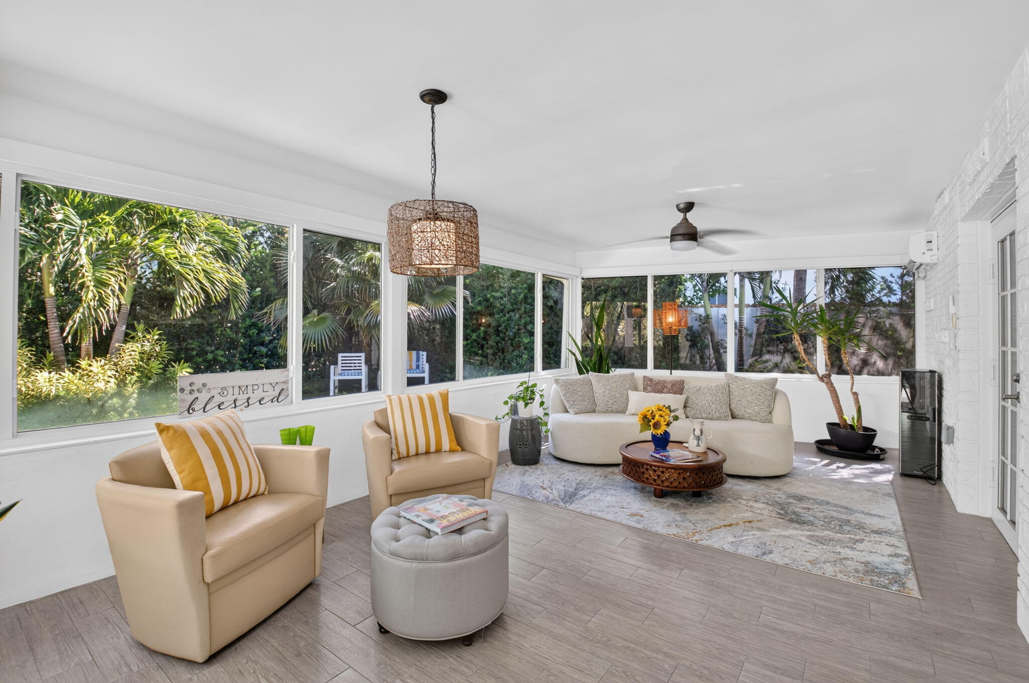 SUNROOM HAS REMOTE SHADES AND A SPLIT A/C SYSTEM