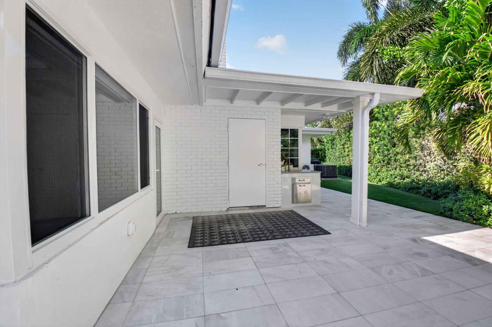 PATIO COVERED AREA LARGE ENOUGH FOR A DINING TABLE, LARGE CLOSET HAS LIGHTING AND ELECTRIC OUTLET INSIDE