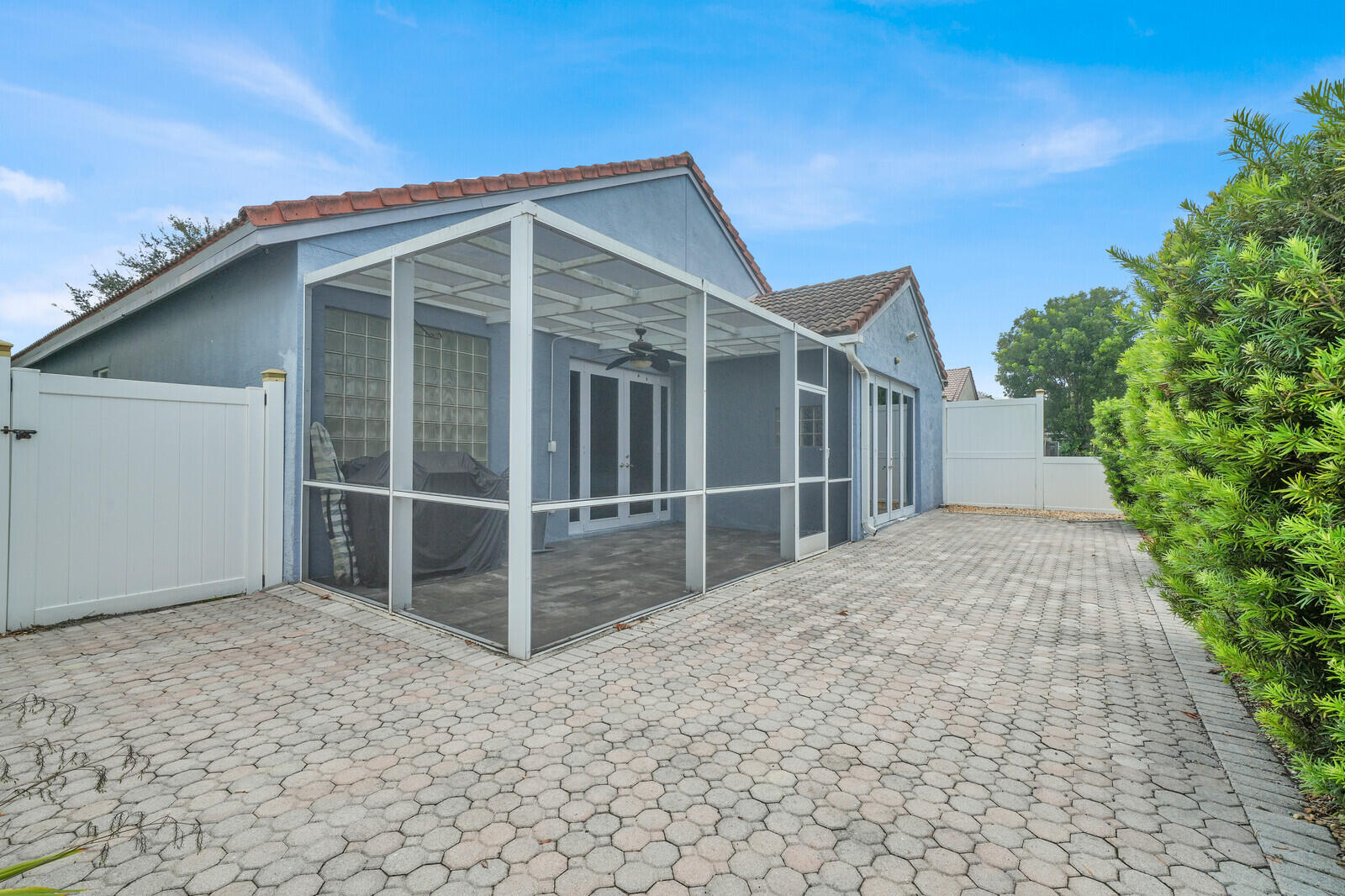 IMPACT DOORS WITH FULLY PAVED AND FENCED IN YARD