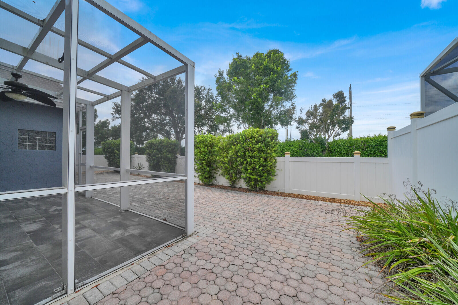 IMPACT DOORS WITH FULLY PAVED AND FENCED IN YARD