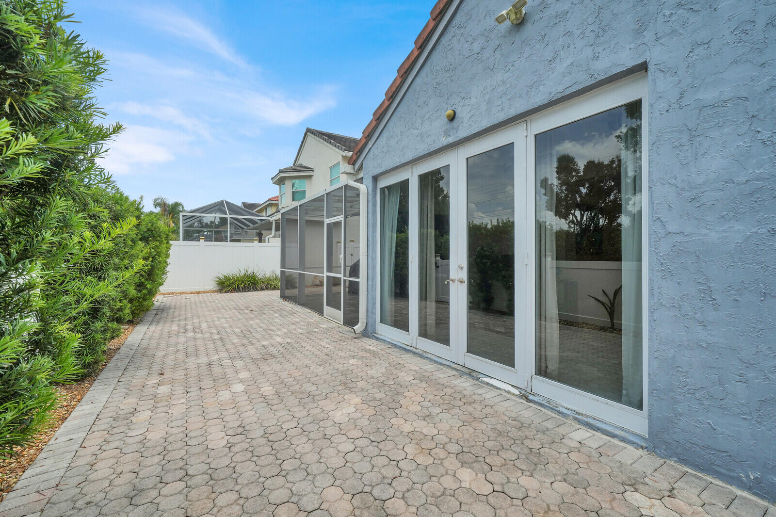 IMPACT DOORS WITH FULLY PAVED AND FENCED IN YARD