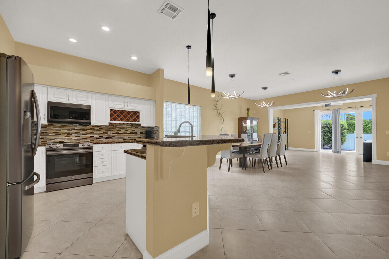 KITCHEN OVERSEEING SECOND LIVING ROOM / DINING AREA