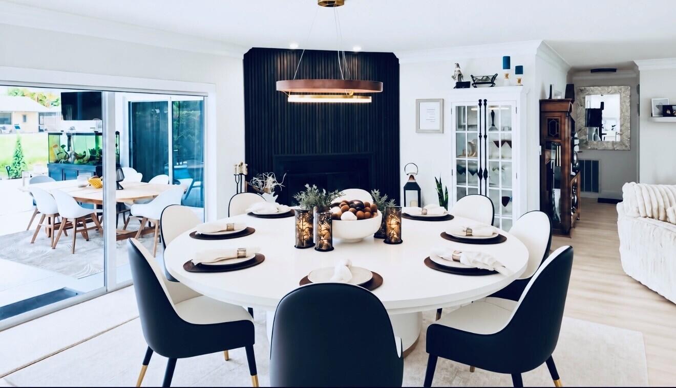 Electric Sliding door blinds offer privacy at the touch of a button while dinning or entertaining next to the Fireplace overlooking the