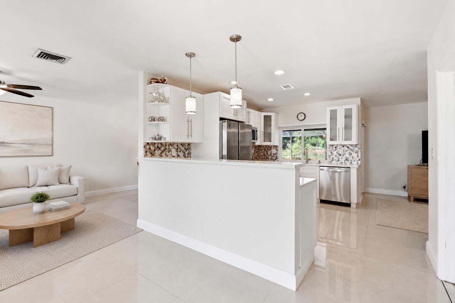 Kitchen centers the home. (virtually staged for illustrative purposes; no permanent features or finishes have been altered) Kitchen centers the home. (virtually staged for illustrative purposes; no permanent features or finishes have been altered)
