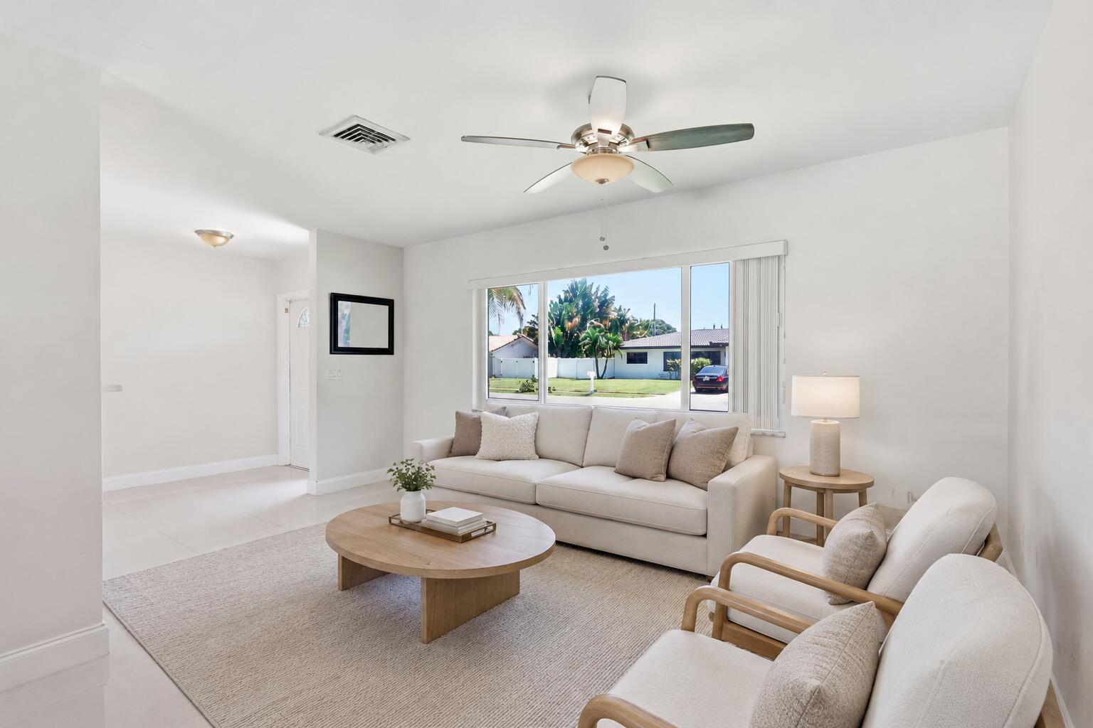 Front Entry and Living Room (virtually staged for illustrative purposes; no permanent features or finishes have been altered) Front Entry and Living Room (virtually staged for illustrative purposes; no permanent features or finishes have been altered)