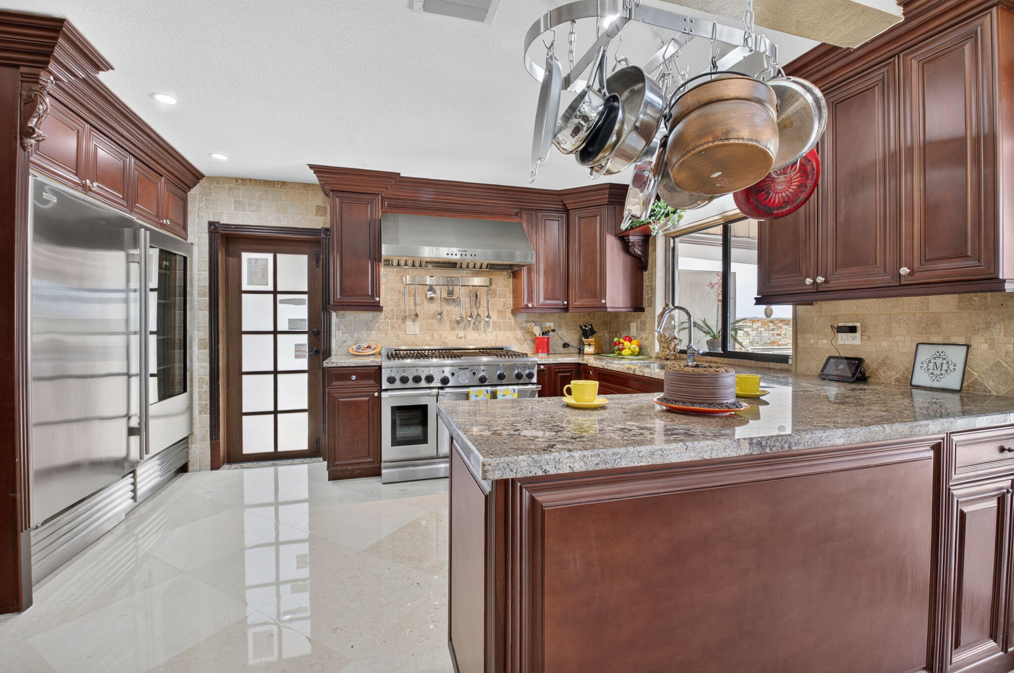 Chef inspired kitchern features substantial custom cabinerty.