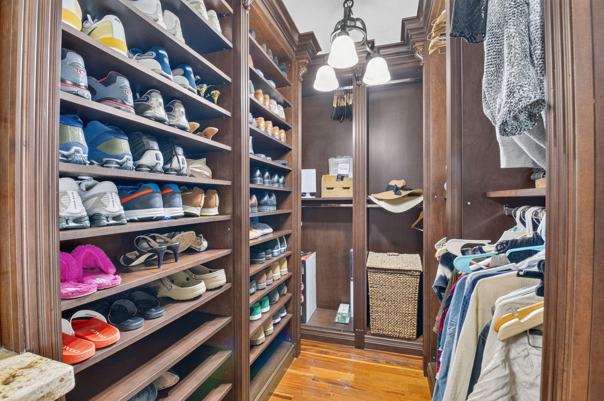 Walk in closet with build out is perfect for fashion fans!