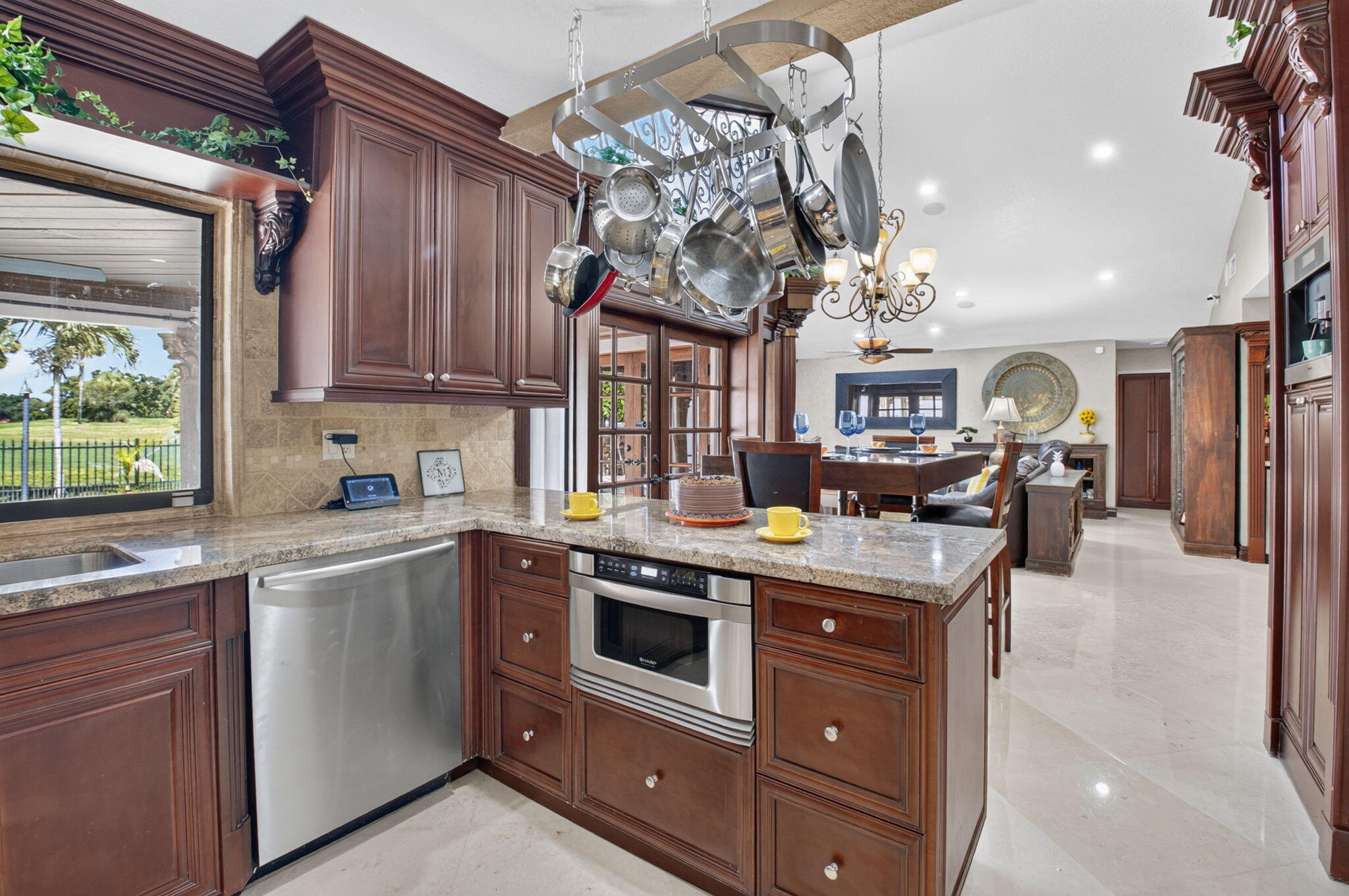In cabinet microwave. All stainless steel appliances. Plenty of natural light.
