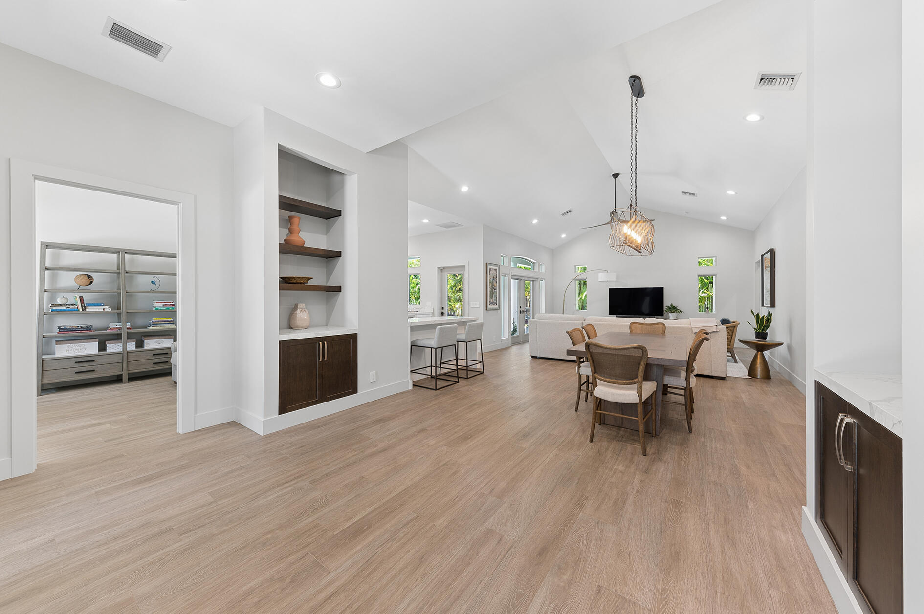 Generous Foyer Entrance with matching shelves and built-in cabinetry