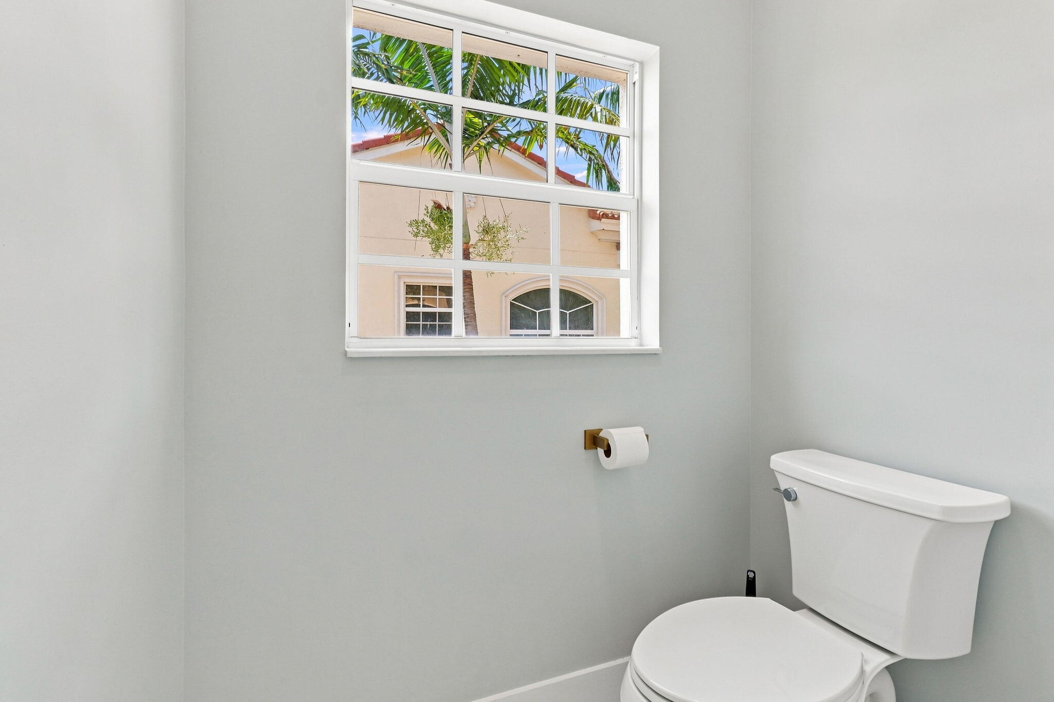 White framed window with grid inserts