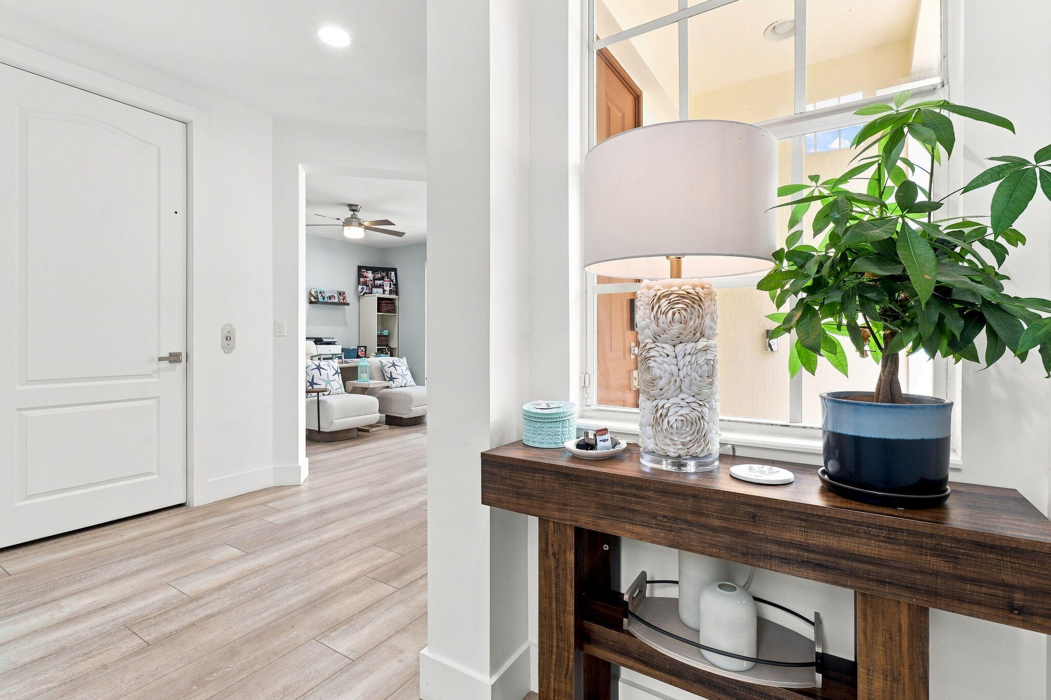 Luxury vinyl flooring complements the crisp bright walls and doors