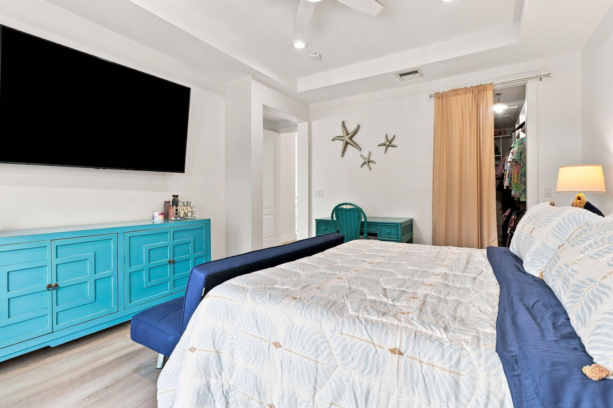 Recessed lighting, luxury vinyl flooring, and a tray ceiling