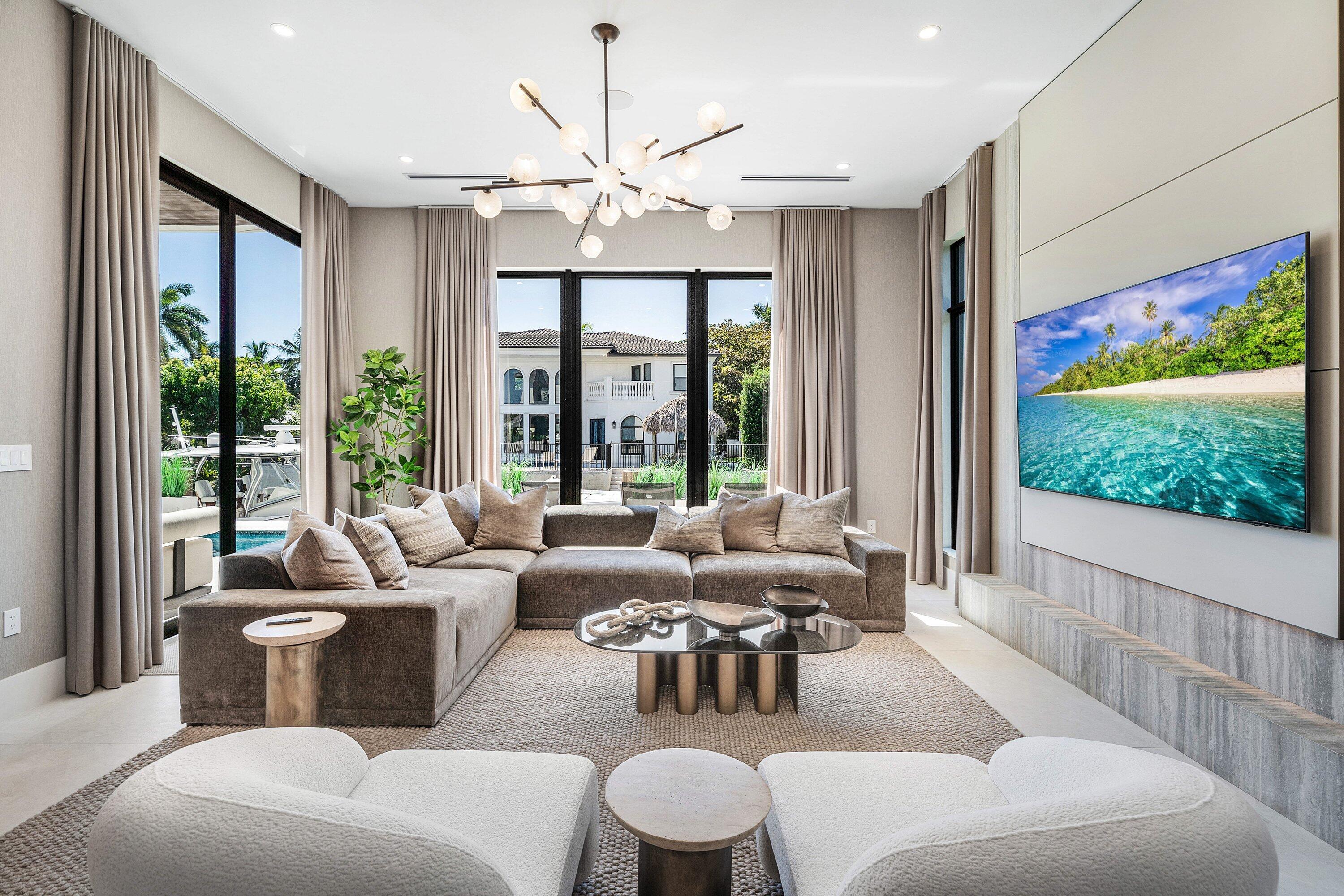 Built-in media console with integrated television, backlighting, and flush cabinetry