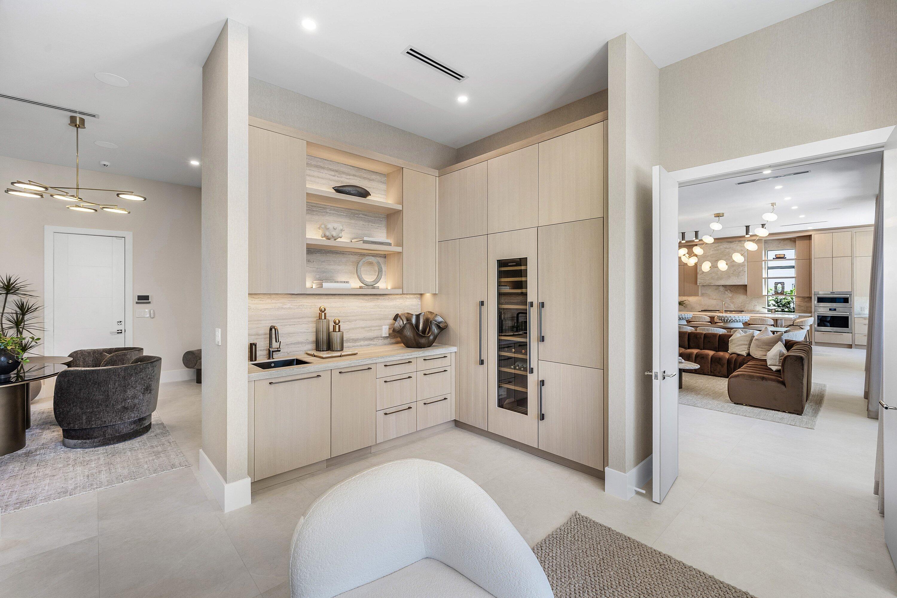 Natural wood cabinetry with Liebherr Refrigerator, Freezer, 80-Bottle Wine Storage and Miele Dishwasher